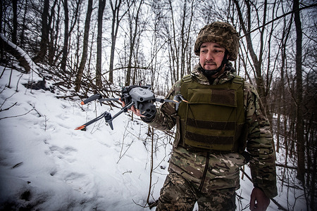 Ukrainian soldier with a reconnaissance drone on the Sumy front.
In the harsh winter conditions, the Ukrainian army uses reconnaissance drones to identify targets and artillery units to strike them.
