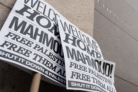 Placards seen outside Columbia University after the 'Welcome Home' rally outside the Cathedral of St. John the Divine in New York City. Khalil is out on bail after U.S. District Judge Michael Farbiarz found that the standards for his 104 day detention were “not met”.