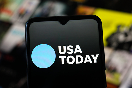 In this photo illustration, the USA Today logo is seen displayed on a smartphone screen.