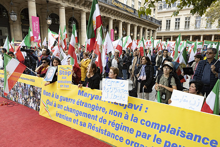 Supporters of the NCRI and MEK are seen rallying in front of the Comédie-Française in Paris, carrying banners with Maryam Rajavi's message against foreign war and appeasement. Supporters of the National Council of Resistance in Iran (NCRI) and Mojahedin-e-Khalq (MEK) rallied in Paris on September 13, 2025, marking the anniversary of the 2022 Iran uprising. Demonstrators honoured the victims of 2022 protests, held portraits of political prisoners, and called for an end to executions and repression in Iran.