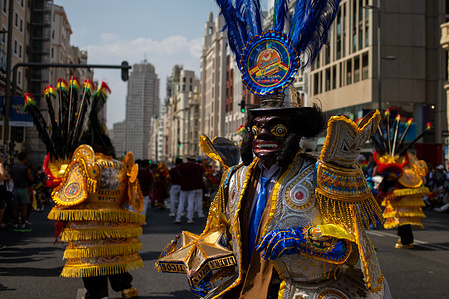 A man dressed in traditional Bolivian costume dances during the Urkupiña festival. Bolivian residents from across the Spanish state gathered on Madrid's Gran Via to celebrate the traditional religious festival of the Virgin of Urkupiña. The Virgin of Urkupiña is a devotion to the Virgin Mary holding the Child Jesus in her arms, venerated on August 15 in the city of Quillacollo, the provincial capital 14 km from Cochabamba, Bolivia.