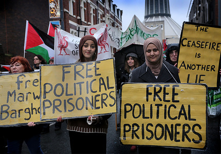 Protesters march behind placards during the protest. Supporters of the Filton 24 pro-Palestine prisoners, rallied in Liverpool in solidarity with the 24 individuals held on remand and the seven currently on hunger strike in prisons across the UK. Several prisoners have refused food for 35 days, and although three have been hospitalized, neither the government nor mainstream media has engaged with their situation. The prisoners have been held on remand for over a year after being arrested for targeting the Filton site of Israeli arms company Elbit Systems in Bristol and destroying quadcopter drones they say were destined for use against Palestinians in Gaza. The hunger strikers are making five demands: an end to censorship and surveillance of communications, immediate bail, a fair trial, the de-proscription of Palestine Action, and the shutdown of Elbit Systems. More prisoners are expected to join the hunger strike imminently.