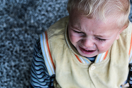 A baby crying seen inside a UN (United Nations) school in Gaza City where Palestinian families take shelter after fleeing from their homes in the Shejaiya neighborhood and the city of Beit Lahia during Israeli airstrikes, amid the escalating flare-up of Israeli-Palestinian violence.