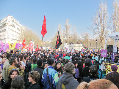 A large crowd of demonstrators gathers with flags and banners during the International Women’s Day rally. Demonstrators gathered in Paris on March 8, 2026, marking International Women’s Day with rallies and marches calling for gender equality, women’s rights, and solidarity with women facing discrimination and violence worldwide.