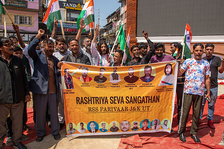 Members of the Rashtriya Swayamsevak Sangh (RSS), also known as Sangh, is a right-wing Hindu Nationalist paramilitary volunteer raising pro Indian slogans, during India's 77th Independence day celebrations in Srinagar. August 15th annually commemorates India's freedom from British colonial rule in 1947.