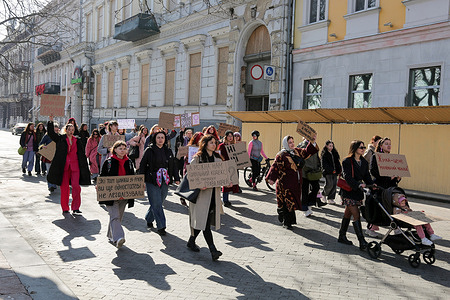 Participants seen holding placards expressing their opinion as they walk along Primorsky Boulevard. A women's rights march in honor of International Women's Day took place along the central streets. Participants want to remind society about respecting women's rights.