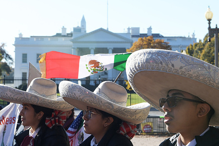 Protesters wearing Mexican hats, during the demonstration.
Mexicans and Mariachis gathered in Lafayette Park demanding President Joe Biden to pass the Immigration Reform Bill before his Bilateral Meeting with Mexico, President Manuel Lopez Obrador, at White House.