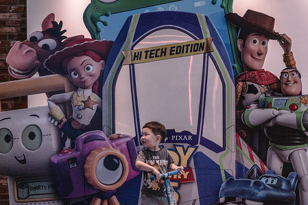 A child passes by a Toy Story 5 billboard. The movie, Toy Story 5 is scheduled for a worldwide release on June 19, 2026. Disney and Pixar are rolling it out globally as their premier summer blockbuster.