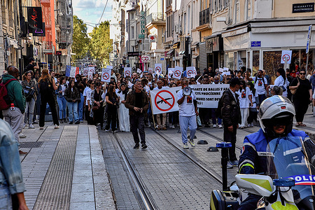 Protesters march in the streets of Marseille holding a banner and placards during the demonstration. Several hundred people participated in a white march in memory of Socayna, a young student killed in her room by a stray bullet during drug-related violence in Marseille on September 10, 2023.