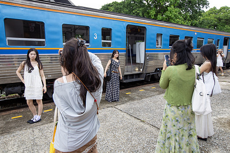Chinese tourists are seen posing and taking photos near a train carriage at Lamphun Railway Station, as retro travel becomes a trending activity on Xiaohongshu in Thailand. Xiaohongshu, also known as RED, is a popular Chinese social media and e-commerce platform where users share lifestyle content, travel tips, and photography recommendations. Widely used by Chinese travelers, the platform has become an influential source for discovering destinations and travel trends. Its user-generated content can turn lesser-known locations, such as Lamphun railway station in Thailand, into popular tourist attractions.