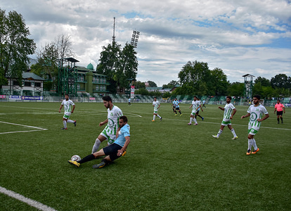 Abid Nabi of team SRTC is seen in action during a football league match with team Rahim Greens in Srinagar, the summer capital of J&K, India. The annual league football tournament of J&K Football Association kick started at Synthetic Turf here in Srinagar. The tournament is organized by District Football Association Srinagar, Medical Partner Rahim Green & Football Sponsor Sports International.
(Final Score: SRTC 1-0 Rahim Greens)