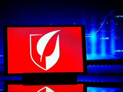 In this photo illustration, a Gilead Sciences, Inc. logo seen displayed on a tablet.