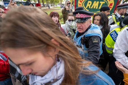 A Metropolitan Police officer pushes a pro-Palestinian supporter during the National March for Palestine. Thousands of pro-Palestinian demonstrators took part in the National March for Palestine in London, organised by the Palestine Solidarity Campaign (PSC). The march began at Victoria Embankment and proceeded to Whitehall, with attendance estimated at between 15,000 and 20,000 people. The demonstration took place three days after the third anniversary of the Hamas attacks on Israel on 7 October 2023, as protesters called for Palestinian rights and an end to the conflict in Gaza.