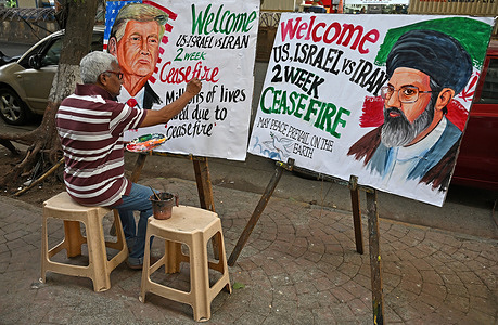 A teacher from Gurukul school of art paints a poster of US President Donald Trump (L) and Supreme Leader of Iran Mojtaba Khamenei (R) with a message welcoming two weeks of ceasefire between US and Iran outside their art school in Mumbai. US and Iran agreed to a 2 week ceasefire, before US President Donald Trump's threat to end the whole civilisation in Iran if Iran doesn't open Strait of Hormuz.