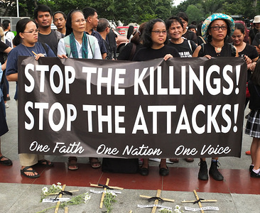 Protesters hold a banner with a slogan, Stop the Killings, Stop the Attacks during the demonstration.
Families of slain victims of alleged summary killings at Negros province staged a Protest rally at Liwasang Bonifacio in Manila during The National Day of Mourning & Solidarity to call for an end to the killings in the region.