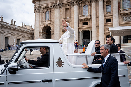 Pope Leo XIV leaves St. Peter's Square at the end of his first Wednesday General Audience.