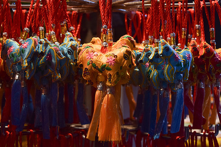 Horse lucky charms are seen on sale at a store in Chinatown ahead of the Chinese New Year, also known as the Lunar New Year. This year is the Year of the Horse.