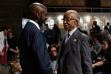 Democratic mayoral candidate Michael Blake speaks with Reverend Al Sharpton before the 'Mayoral Candidate Forum All Faiths, All Candidates' event at Cathedral of St. John the Divine.