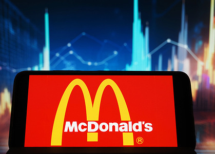In this photo illustration, the McDonald's Corporation logo seen displayed on a smartphone.
