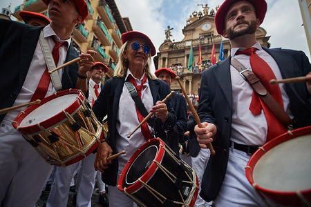 Pamplona bagpipers perform during the San Fermin festivities. At 12pm the San Fermin festivities began with the launch of "El Chupinazo" from the Pamplona City Hall. During the festival, the city of Pamplona does not sleep for seven days. The festival features the famous running of the bulls, bullfights, lunches, dinners and music.