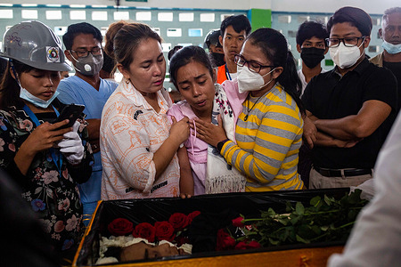 (EDITORS NOTE: Image depicts death) Relative react at the funeral of Chit Min Thu, a pro-democracy protester killed by Security Forces during a demonstration against the military coup in Yangon where Myanmar Security Forces attacked protesters with rubber bullets, live ammunition, tear gas and stun bombs killing several protesters. Myanmar's military detained State Counsellor of Myanmar Aung San Suu Kyi on February 01, 2021 and declared a state of emergency while seizing the power in the country for a year after losing the election against the National League for Democracy (NLD).