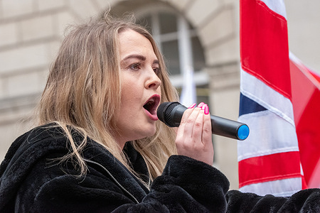 Co leader of Britain First speaks to crowd. Ashlea SimonPaul Golding the leader of Britain First made a speech in ST Peters Square Manchester following a city centre march by the far right group. Anti facist groups formed counter protests along the route . Police struggled to keep the opposing groups apart. Paul Golding, the leader of Britain First, made a speech following a speech by co leader Ashlea Simon. Golding demanded remigration of immigrants and the execution, as traitors, of political figures including the Prime Minister Keir Starmer. Britain First supporters carried England flags and shouted abuse at the counter protesters who included members from Stand Up to Racism. Manchester Council had paid for displays for Manchester to Stand against hate throughout the city. Manchester UK Picture: garyrobertsphotography