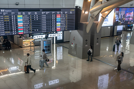 People walk at Gimpo International Airport.