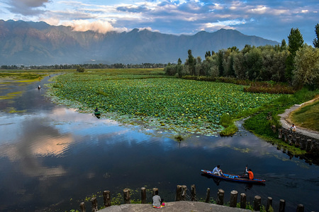 A Kashmiri boatman seen ferrying locals in his traditional boat during sunset at the Nigeen Lake in Srinagar, Indian administered Kashmir. Kashmir is the northernmost geographical region of the Indian subcontinent. It is currently a disputed territory, administered by three countries: India, Pakistan and China.