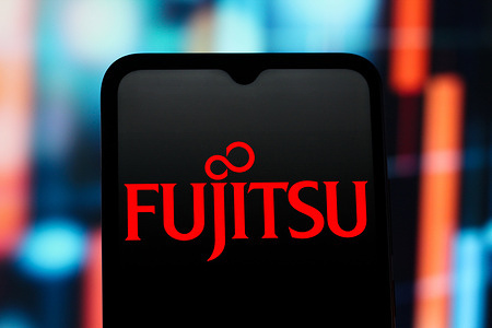 In this photo illustration, the Fujitsu logo is seen displayed on a smartphone screen.