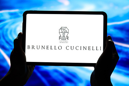 In this photo illustration, the Brunello Cucinelli logo is displayed on the screen of a smart tablet.