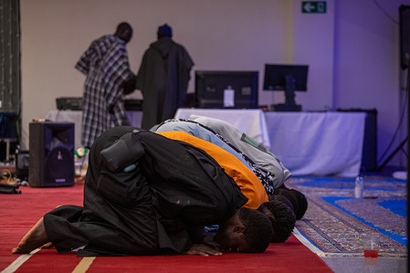 A group of men prays during the preparations for the celebrations of the Great Magal of Touba. The Grand Magal of Touba is the most important religious festival of the Mouride Brotherhood in Senegal, a branch of Sufi Islam. It is celebrated annually in the city of Touba to commemorate the life and teachings of its founder, Cheikh Ahmadou Bamba.