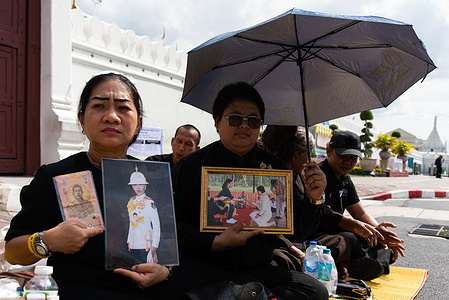 Mourners hold portraits of Thai Princess Bajrakitiyabha during the royal procession of Thai Princess Bajrakitiyabha to her funeral outside the royal grand palace in Bangkok. Princess Bajrakitiyabha died at the age of 47 on 12 June 2026 at the Chulalongkorn Hospital after three and a half years in a coma following a collapse caused by a heart condition in December 2022.