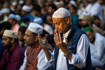 A group of men pray at a sports court in the Lavapies neighborhood of Madrid. The Muslim community of Madrid celebrates the Feast of the Lamb. The event took place on the sports fields of Parque Casino de la Reina, in the Madrid neighborhood of Lavapies.