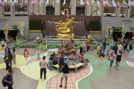 People are seen in Rockefeller Center, Manhattan, New York City.
