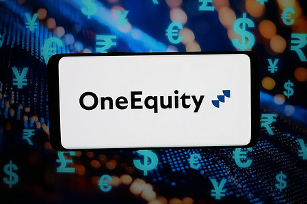 In this photo illustration, the logo of US private equity company One Equity Partners is displayed on a smartphone in front of abstract background on computer screen.