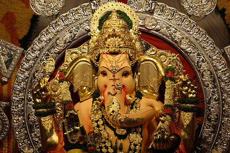 Idol of elephant-headed Hindu god Ganesha is unveiled for the devotees and media at Gowd Saraswat Brahman (G.S.B.) Seva Mandal (committee). Gowd Saraswat Brahman (G.S.B.) Seva Mandal (committee), one of the most iconic and revered Ganesha in the city will be celebrating its 72nd year of the festival, visited by lakhs of devotees. The Maha Ganapati idol is adorned with over 66 kg of pure gold and 335 kg of silver jewellery.