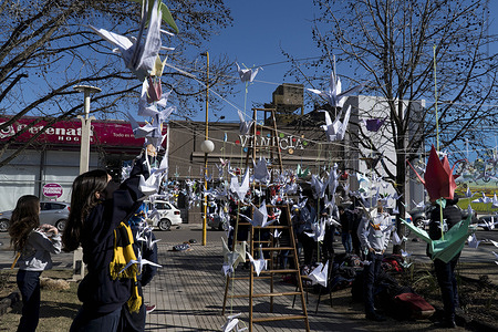 High school students of Firmat, hang a thousand origami cranes during "A Day for Peace" event marking the 77th anniversary of the atomic bombing of Hiroshima by the USA.