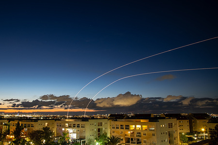 An Israeli Air defense system intercepts a ballistic missile barrage launched from Iran to central Israel during the missile attack.