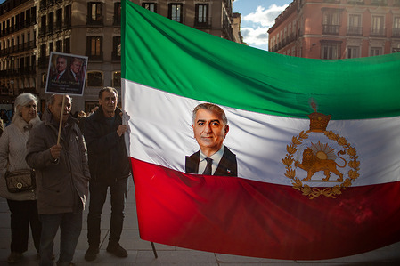 Members of the Iranian community in Madrid hold a banner with the face of Mohammad Reza Pahlavi, Emperor of Iran during the rally. A protest was held in Madrid's Plaza de Callao by Iranians residing in Spain, demonstrators demanded an end to the violence and repression by the Islamic Republic regime during the protests in Iran.