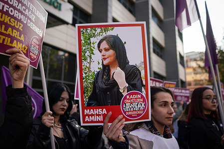 A protester holds a picture of Mahsa Amini, who was killed by the morality police in Iran during the demonstration. We Will Stop Femicides Platform Women Assembly, held a protest in Sakarya Square on the International Day for the Elimination of Violence Against Women.