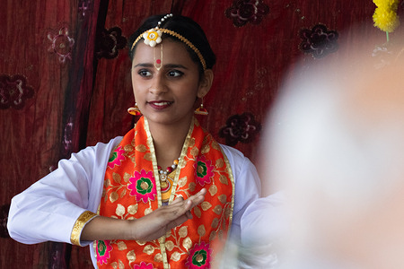 A young performer wearing traditional Indian dance costume performs mudras, the precise hand gestures that form part of classical Indian dance vocabulary. ISKCON Milton held its seventh annual Ratha Yatra, or Festival of Chariots, at the Milton Sports Centre. Ratha Yatra is an annual Hindu chariot festival associated with the deity Jagannath, a form of Vishnu or Krishna, along with his brother Balabhadra and sister Subhadra. The festival originates in Puri, in the eastern Indian state of Odisha, where it is considered the oldest and largest Hindu chariot festival, celebrated annually on the bright half of the lunar month of Ashadh, which falls in June or July. Organized by ISKCON Milton, the free, public event included a decorated chariot procession through the neighbourhood, traditional dance performances, kirtan music, and a free vegetarian meal.