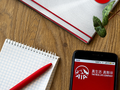 In this photo illustration AIA Group logo seen displayed on smartphone