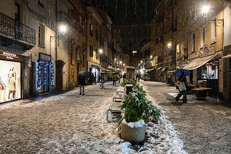 Christmas atmosphere under the snow at Christmas market in Aosta Piazza Emilio CHanoux (Valle D'Aosta Italy).
