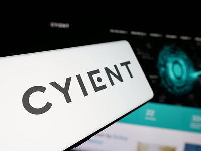 In this photo illustration, a smartphone with the logo of Indian technology company Cyient Ltd. is seen on screen in front of website.