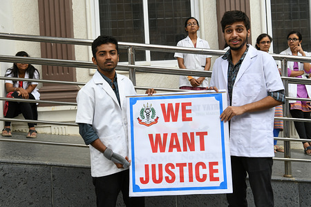 Students hold a placard saying "We Want Justice" during a protest.
Doctors and Students of Bangalore Medical College protest condemning the recent atrocities against doctors raising concerns about their safety.