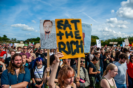 A woman holds a placard against rich people during the demonstration.
The action group 'Woonprotest' organized a protest against the housing crisis in The Netherlands. Thousands of people gathered at the Westerpark in Amsterdam to demand to guarantee adequate and affordable housing for everyone, get a grip on escalating rent and house prices, stop racist and classical housing and demolition policy and stop wealthy investors.