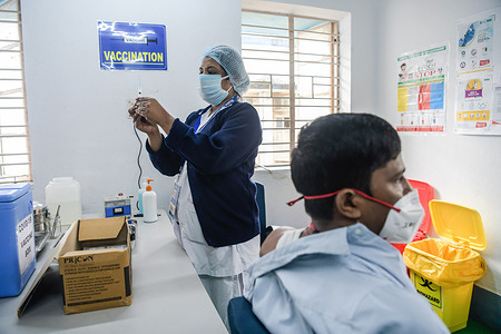 A nurse prepares the Covishield Coronavirus vaccine developed by Oxford University and AstraZeneca Plc and Produced by Serum Institute Of India, at the Baruipur Sub Divisional & Super Speciality Hospital. After a year since the coronavirus pandemic began, claiming over 150.000 lives in India, Prime Minister Narendra Modi launched a nationwide vaccination drive against Covid-19, today.