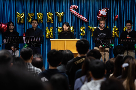 Attendees and members of the congregation seen in black during a church service.
Attendees and members of the congregation wear black during a church service ahead of Christmas, in solidarity with underground churches in China, especially larger establishments such as the Early Rain Covenant which has at least 500 members that are facing persecution.
