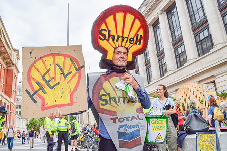 A protester wears an anti-Shell costume during the demonstration outside the Science Museum. Activists gathered outside the museum in South Kensington to protest against Shell's sponsorship of the Our Future Planet climate change exhibition, and as part of Extinction Rebellion's two-week Impossible Rebellion campaign.