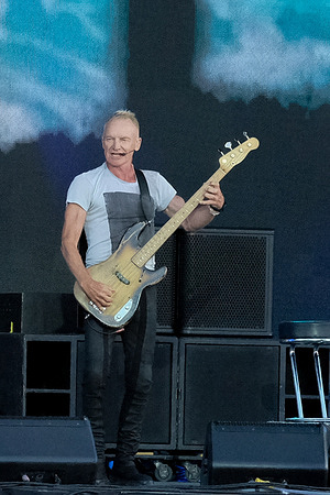 Gordon Matthew Thomas Sumner, known professionally as Sting, former front man with British rock and pop band, The Police, performs live on stage with his backing band at the Isle of Wight Festival.